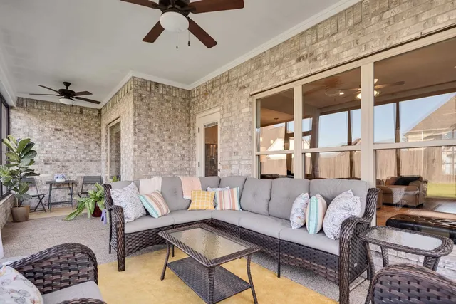 a living room with furniture and a window