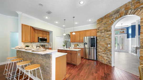 a view of a dining room with furniture and wooden floor