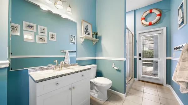 an empty room with fan and windows