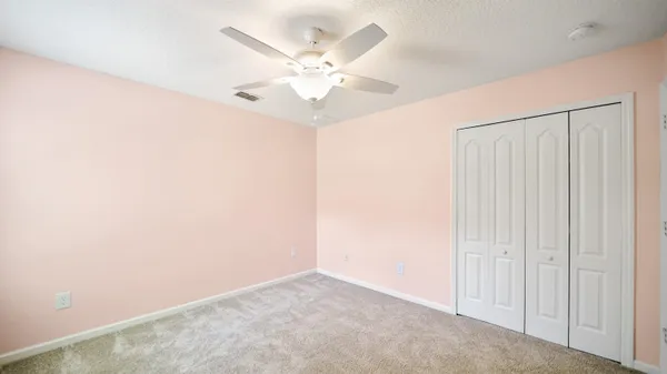 a room with a sink cabinets and wooden floor