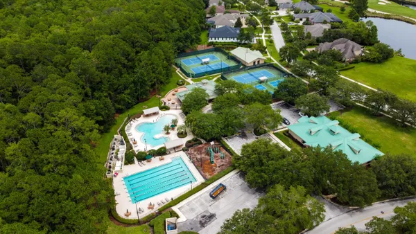 a view of a patio with swimming pool table and chairs