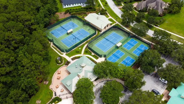 a view of outdoor space with deck and trees