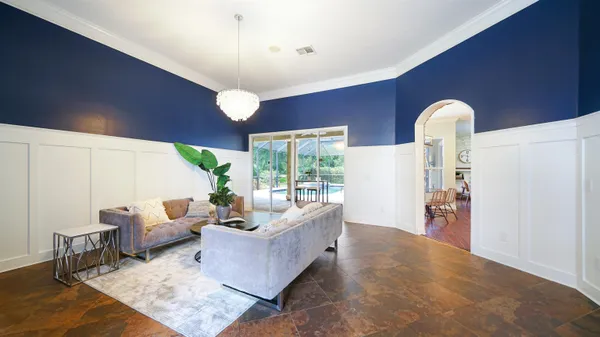 a living room with furniture and a table