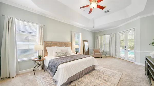 a bathroom with a granite countertop sink mirror and a bathtub