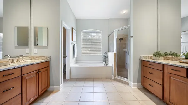 a kitchen with a sink appliances cabinets and wooden floor