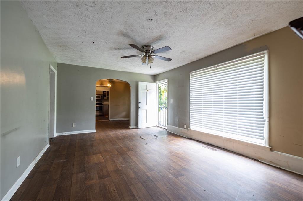 3838 Old Gordon Road Northwest Atlanta, GA 30336 - Photo 5 of 23 wooden floor in an empty room with a window