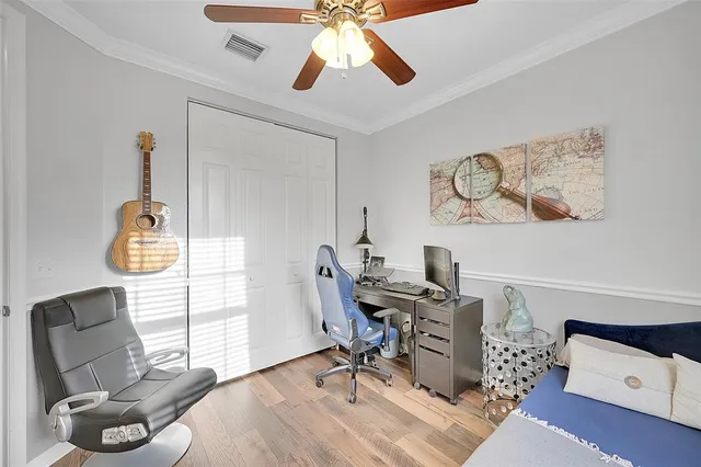 a bedroom with a workspace