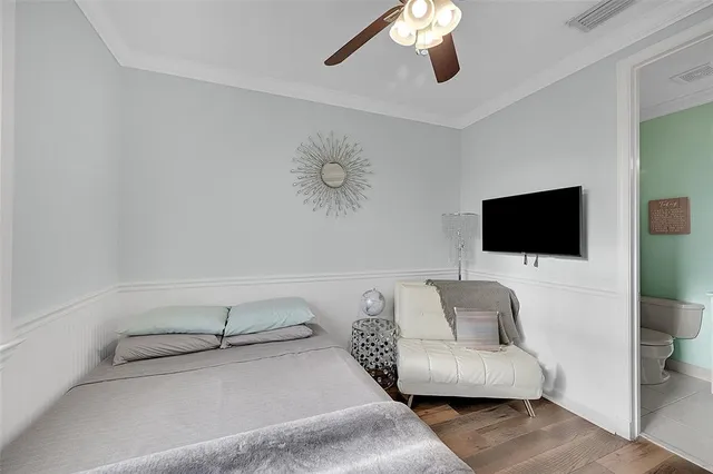 a bathroom with a sink mirror vanity and toilet