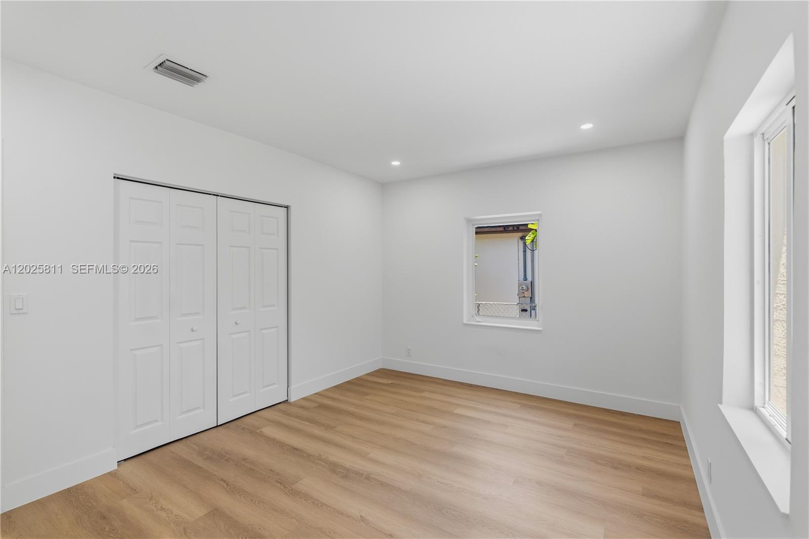 2110 Southwest 15th Street Miami, FL 33145 - Photo 23 of 37 wooden floor in an empty room with a window