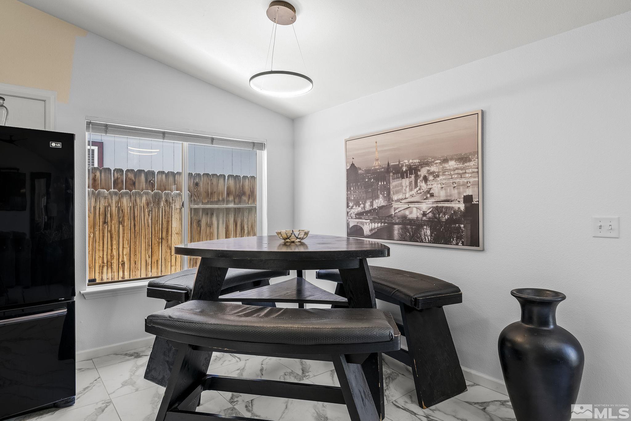 940 Atrium Road Fernley, NV 89408 - Photo 7 of 20 a view of a dining room with furniture window and outside view