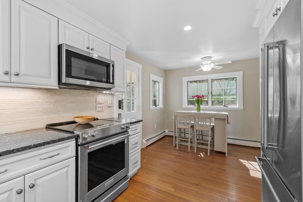 25 Naples Road Melrose, MA 02176 - Photo 13 of 36 a kitchen with stainless steel appliances a stove microwave and refrigerator