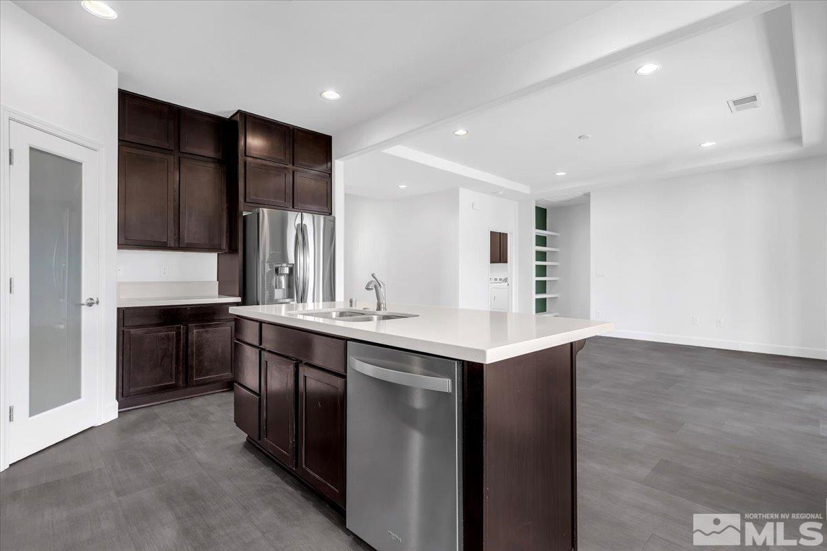 9885 Ash Meadow Drive Reno, NV 89521 - Photo 11 of 40 a kitchen with a sink and cabinets