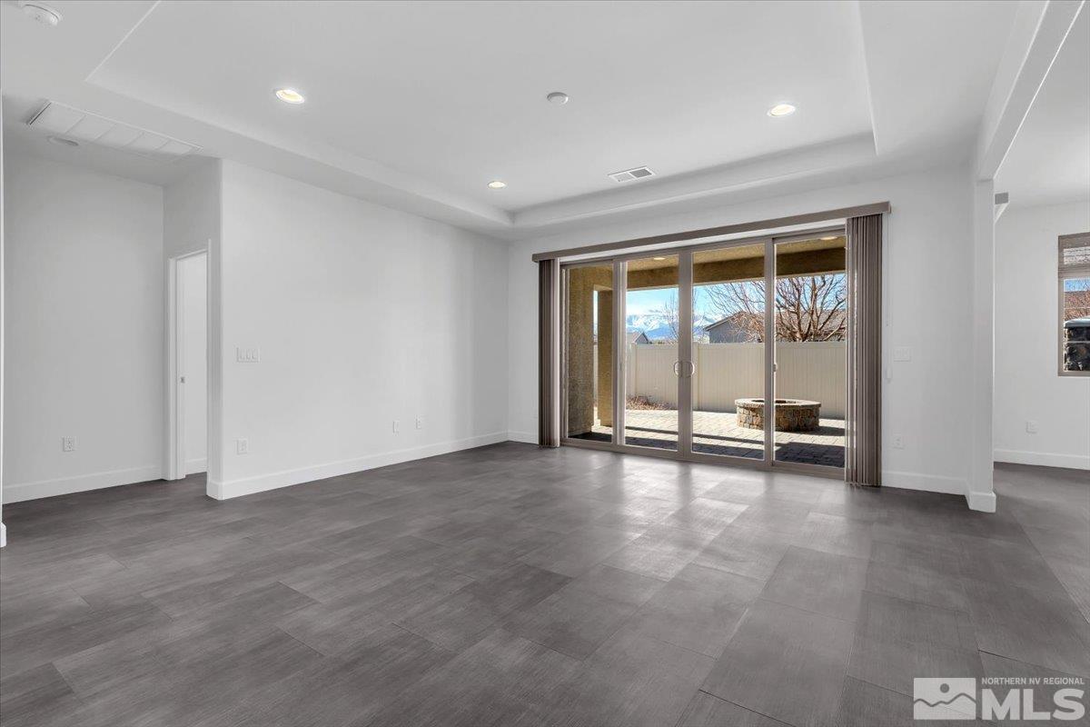 9885 Ash Meadow Drive Reno, NV 89521 - Photo 4 of 40 a view of an empty room with a window