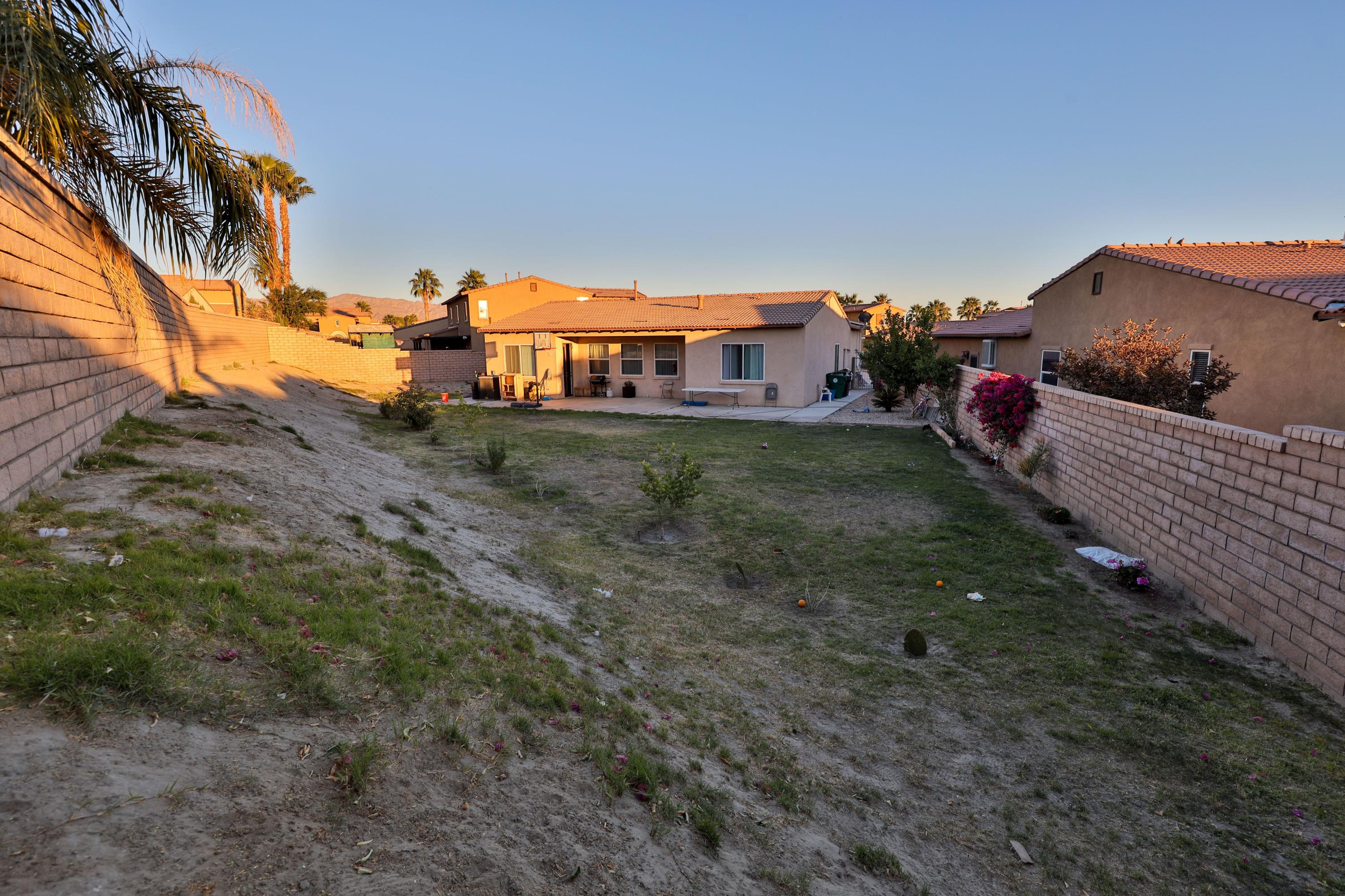 82834 Randsburg Lane Indio, CA 92203 - Photo 12 of 18 a view of a houses with a yard