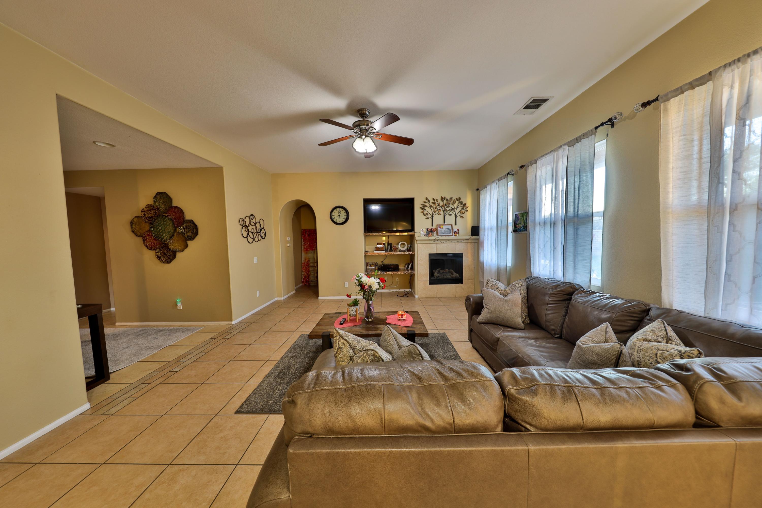 82834 Randsburg Lane Indio, CA 92203 - Photo 5 of 18 a living room with furniture and a flat screen tv