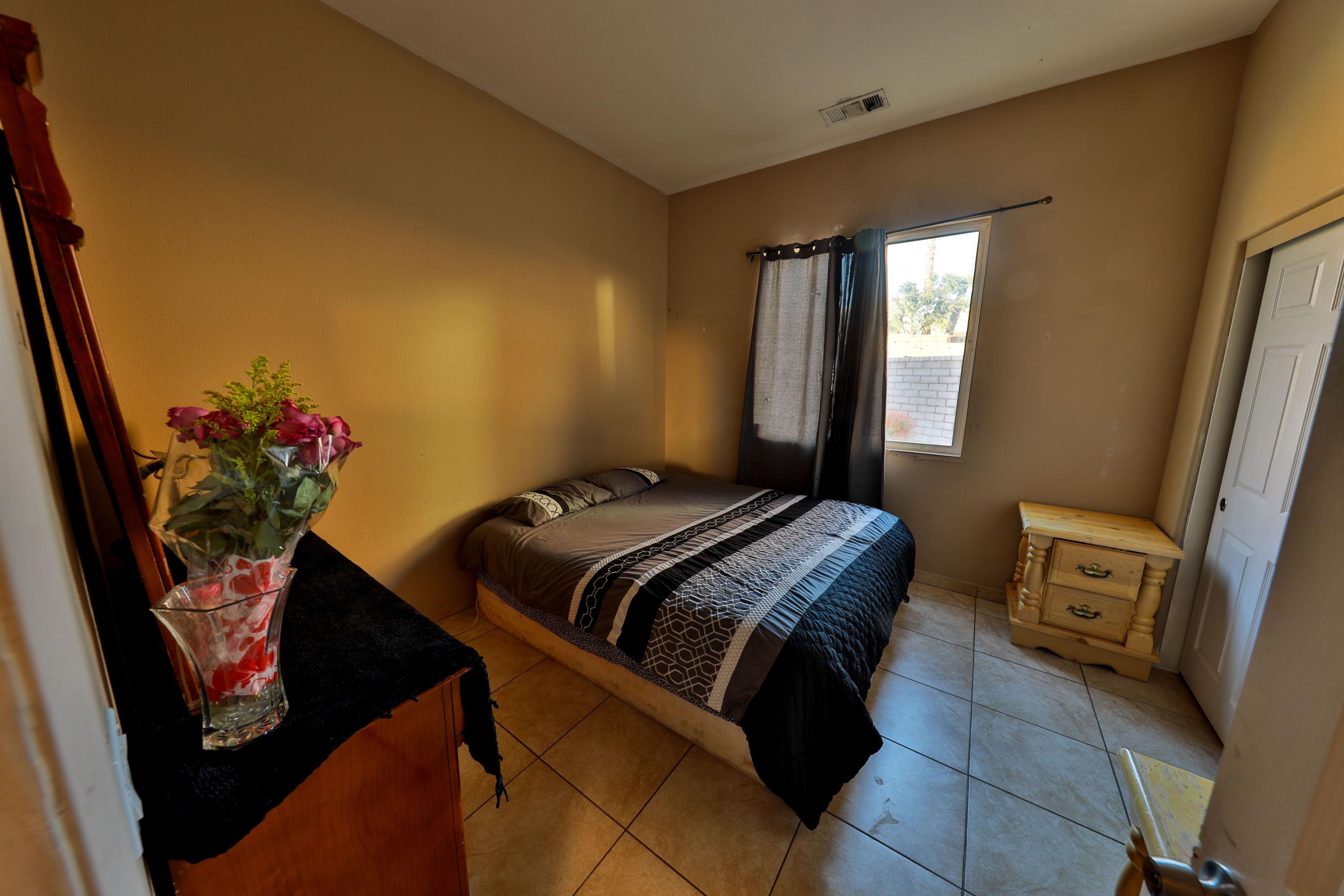 82834 Randsburg Lane Indio, CA 92203 - Photo 9 of 18 a bedroom with a bed and a dresser