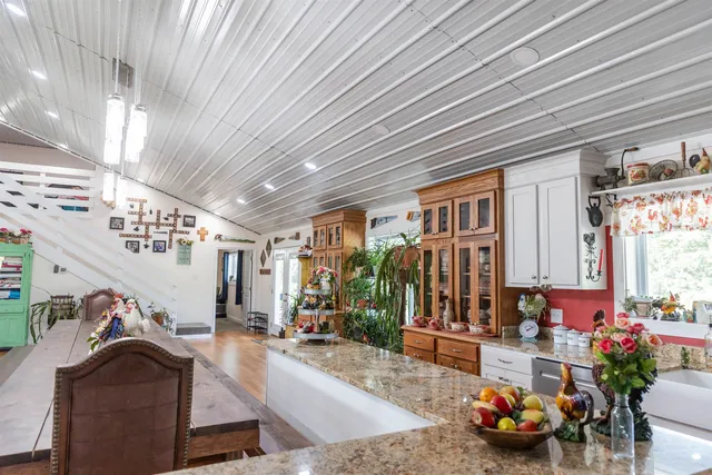 a kitchen with stove and cabinets