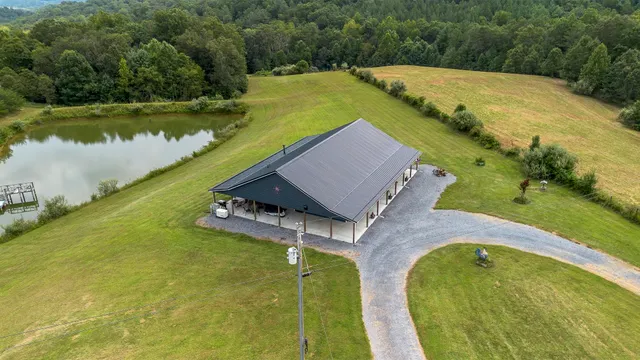 an aerial view of a house with a swimming pool
