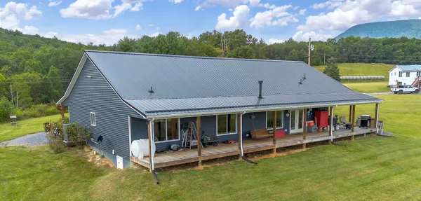 a kitchen with stainless steel appliances granite countertop a refrigerator a stove and a wooden floors