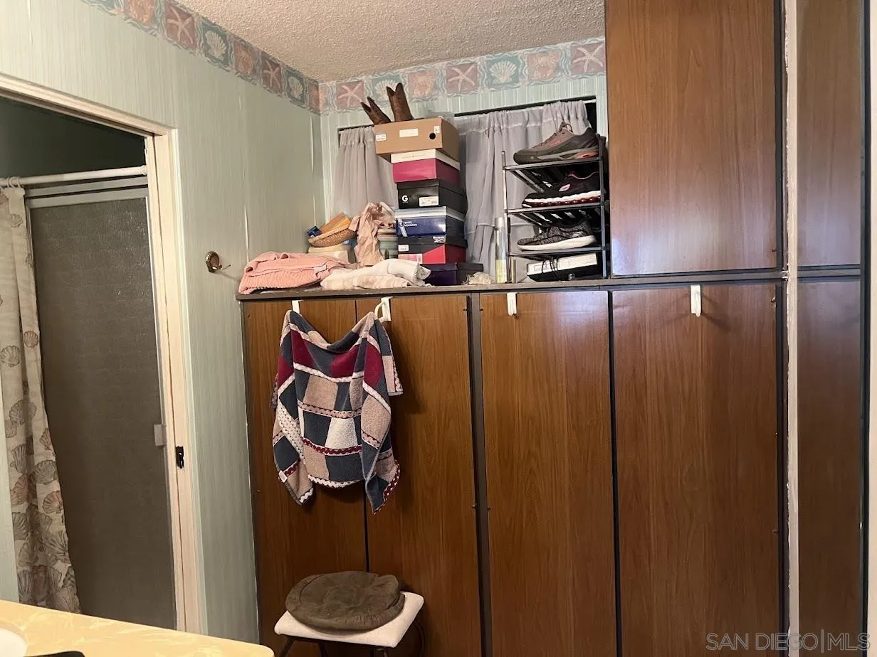 2630 Torrey Pines Road, Unit E21 La Jolla, CA 92037 - Photo 11 of 24 a kitchen with a refrigerator and a sink