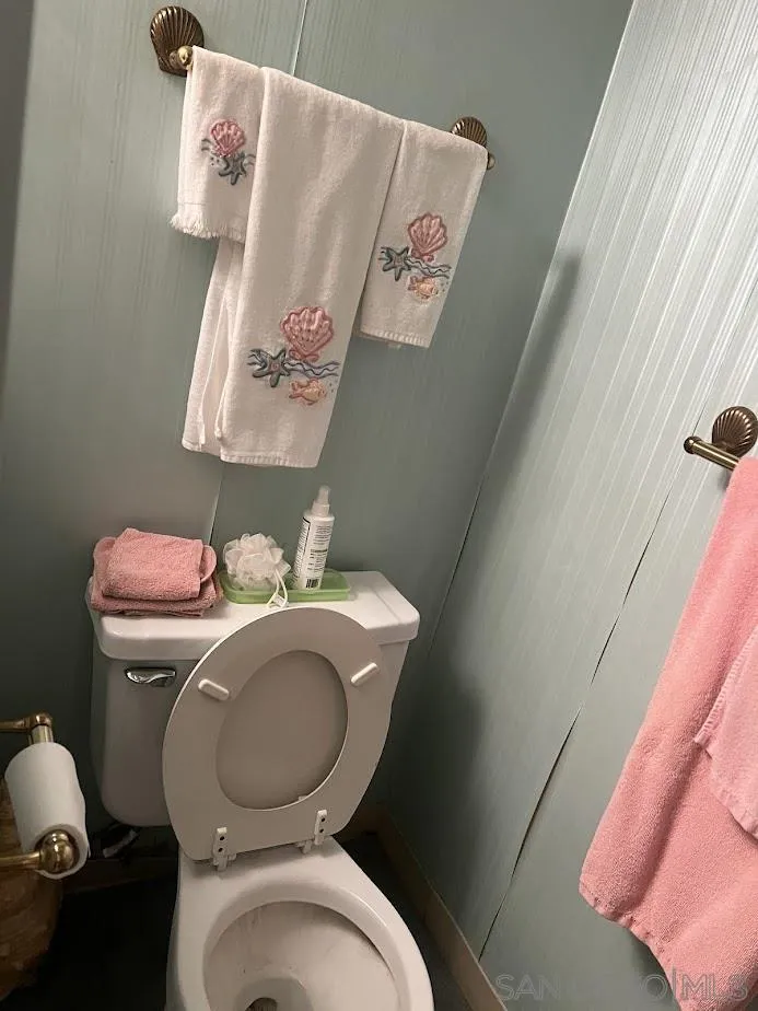 2630 Torrey Pines Road, Unit E21 La Jolla, CA 92037 - Photo 16 of 24 a white toilet sitting next to a bathroom sink