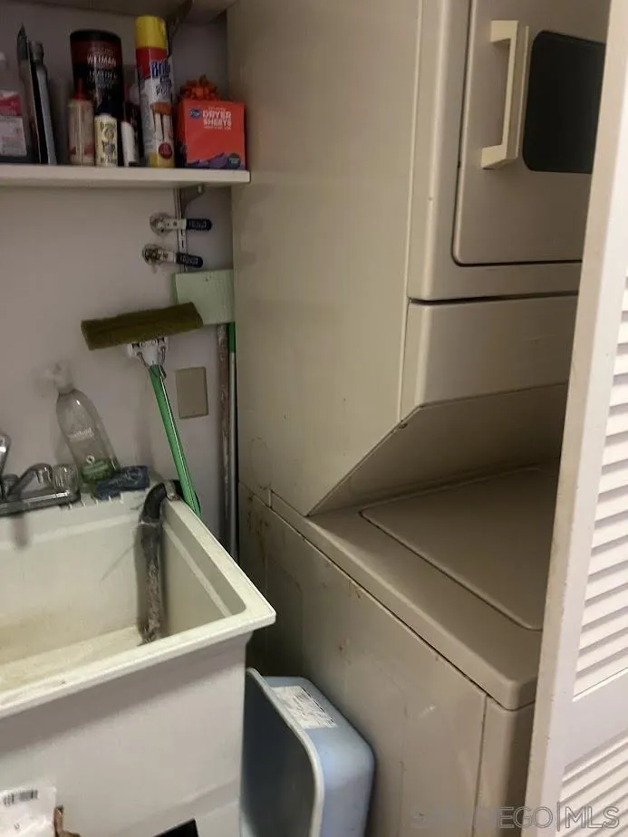 2630 Torrey Pines Road, Unit E21 La Jolla, CA 92037 - Photo 17 of 24 a utility room with dryer and washer