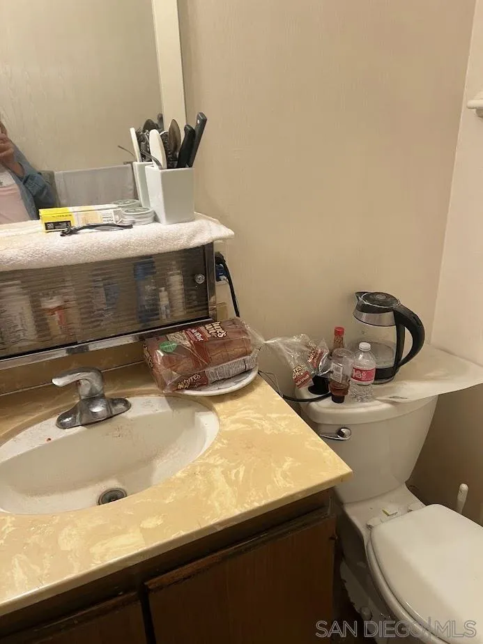 2630 Torrey Pines Road, Unit E21 La Jolla, CA 92037 - Photo 18 of 24 a bathroom with a sink and a toilet