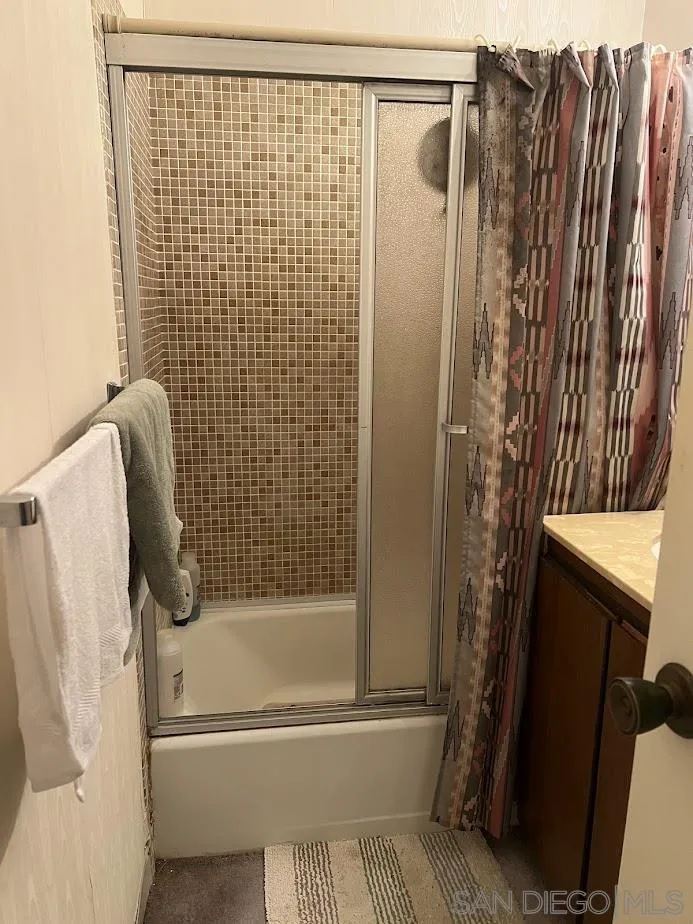 2630 Torrey Pines Road, Unit E21 La Jolla, CA 92037 - Photo 19 of 24 a bathroom with a shower and a toilet