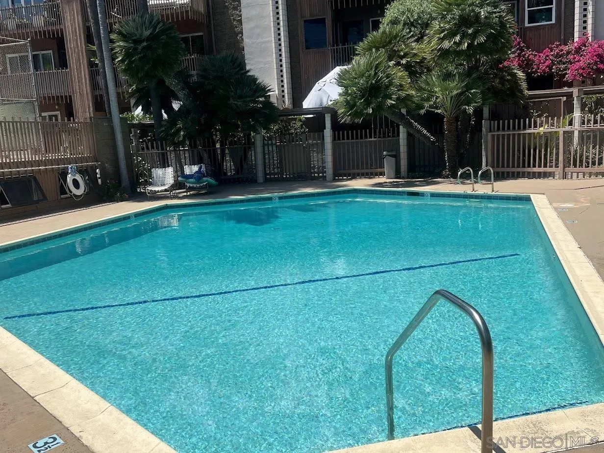 2630 Torrey Pines Road, Unit E21 La Jolla, CA 92037 - Photo 24 of 24 a view of a backyard with brick wall and plants