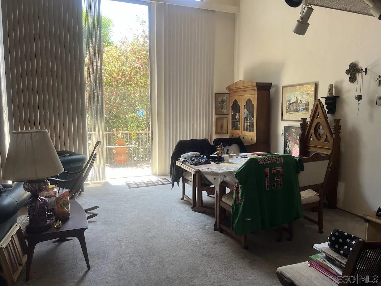 2630 Torrey Pines Road, Unit E21 La Jolla, CA 92037 - Photo 5 of 24 a living room with furniture and a window