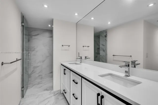 a bathroom with a sink double vanity and a mirror