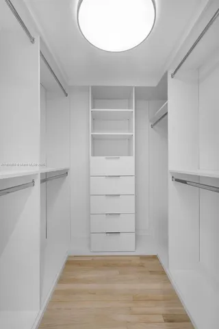 a view of an empty walk in closet