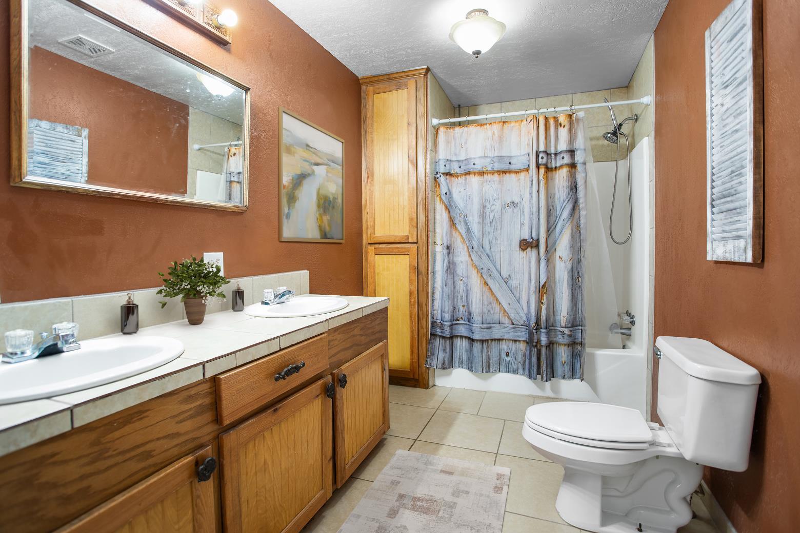991 Herman Nerren Road Huntington, TX 75949 - Photo 17 of 23 a bathroom with a sink toilet and shower