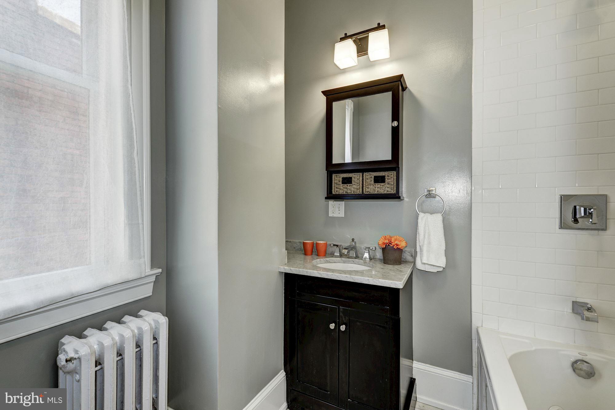 146 U Street Northwest Washington, DC 20001 - Photo 20 of 30 Second upstairs bath with marble, tile and tub