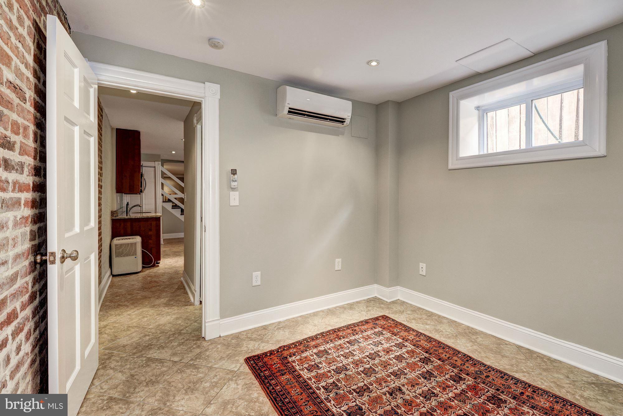 146 U Street Northwest Washington, DC 20001 - Photo 27 of 30 Exposed brick and room for guests