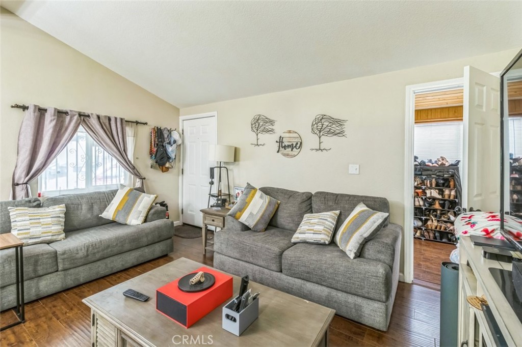 8221 Ilex Street, Unit 10 Rancho Cucamonga, CA 92335 - Photo 13 of 27 a living room with furniture and a couch