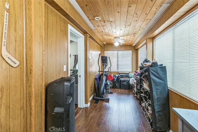 a view of walk in closet with clothes