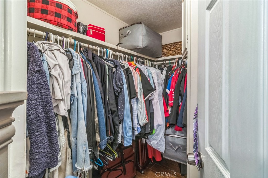 8221 Ilex Street, Unit 10 Rancho Cucamonga, CA 92335 - Photo 27 of 27 a view of walk in closet with clothes