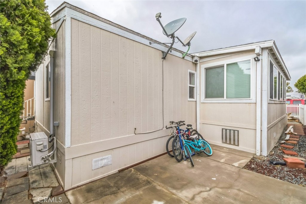 8221 Ilex Street, Unit 10 Rancho Cucamonga, CA 92335 - Photo 3 of 27 a view of porch with a table and chairs