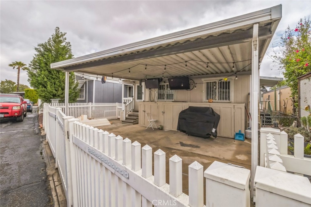 8221 Ilex Street, Unit 10 Rancho Cucamonga, CA 92335 - Photo 9 of 27 a view of a house with backyard and roof deck
