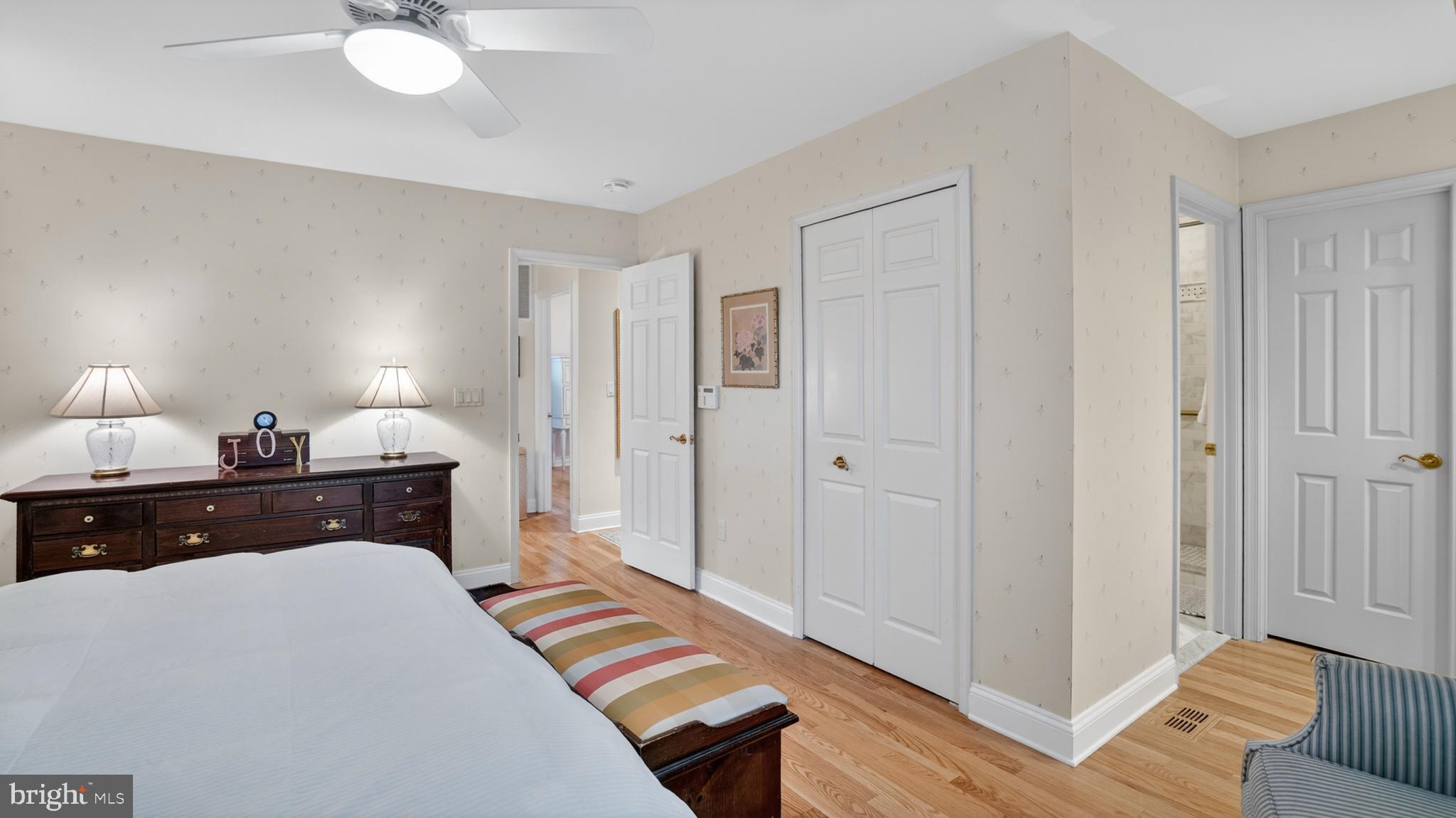 317 Canterfield Road Annapolis, MD 21403 - Photo 29 of 66 a bedroom with a bed and a chandelier