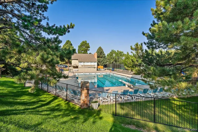 a view of a house with a yard from a lake view