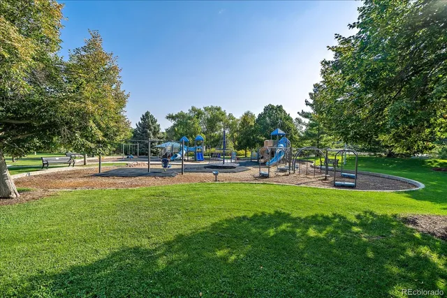 a swimming pool with outdoor seating and garden