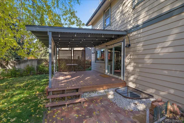 a view of backyard with plants and outdoor seating