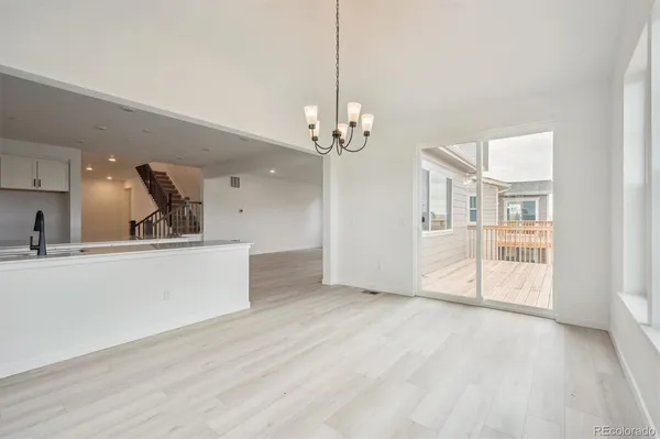 a view of a kitchen with microwave and cabinets