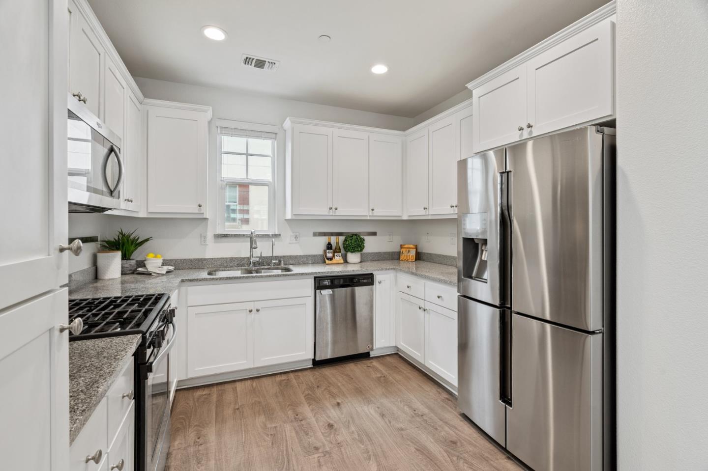 3410 Pyramid Way Mountain View, CA 94043 - Photo 17 of 55 a kitchen with stainless steel appliances a refrigerator sink and stove top oven