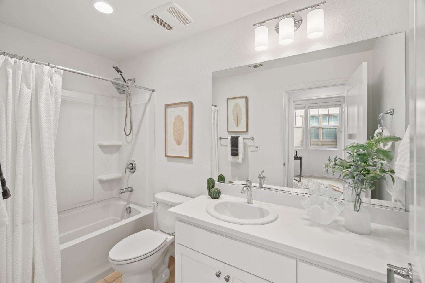 3410 Pyramid Way Mountain View, CA 94043 - Photo 23 of 55 a bathroom with a sink a toilet and a large mirror