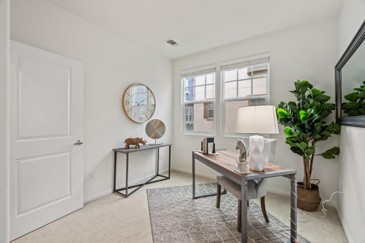 3410 Pyramid Way Mountain View, CA 94043 - Photo 27 of 55 a living room with furniture a potted plant and a window