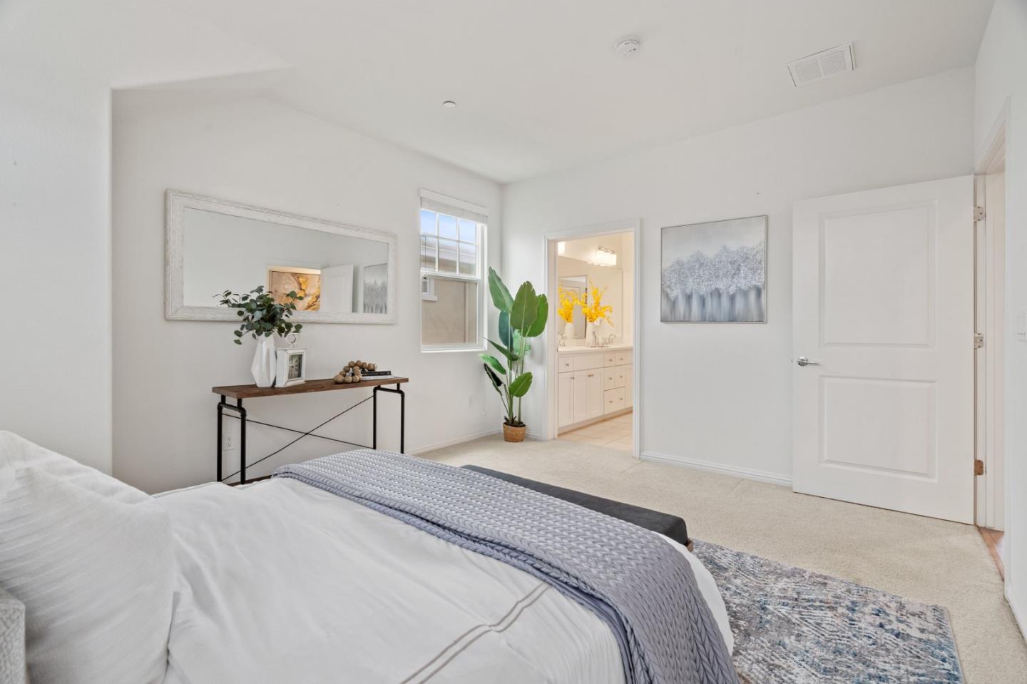 3410 Pyramid Way Mountain View, CA 94043 - Photo 32 of 55 a bedroom with a bed and a chandelier