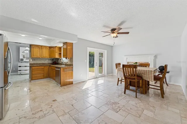 a kitchen with granite countertop cabinets and stainless steel appliances